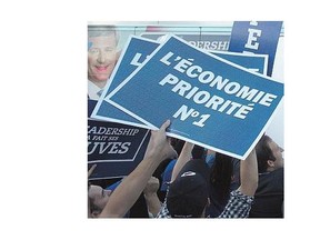 Supporters cheer as Conservative Leader Stephen Harper arrives for Thursday's French-language debate in Montreal.
