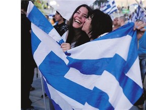 Supporters of the No vote react after the first results of Greece's austerity referendum at Syntagma Square in Athens, Greece, on Sunday.