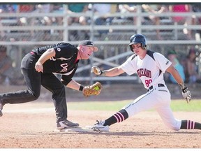 Team Canada infielder Ian Fehrman looks to the umpire to see if he tagged Team New Zealand outfielder Ben Enoka during the World Softball tournament at Bob Van Impe field on Sunday.