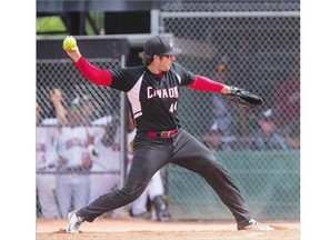 Team Canada pitcher Sean Cleary throws the ball against Team New Zealand during the World Softball tournament at Bob Van Impe field on Sunday. Cleary threw a four-hitter in a 2-1 victory over the defending champs. See the story on C2.