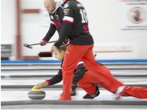Team McEwen second Matt Wozniak throws a rock against Team Carruthers during the Point Optical Curling Classic championship game Monday.