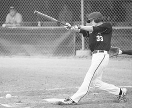 Team New Zealand infielder Cole Evans hits a grounder against the Philippines during the Men's World Softball Championships at Bob Van Imp park on Monday.