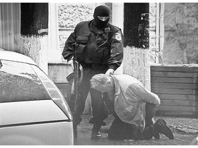 Teodor Chetrus is detained by a police officer in Chisinau, Moldova in 2011 during a uranium-235 sting operation.