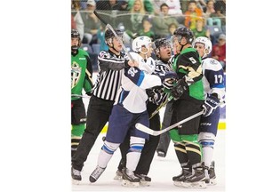 Things heat up between Saskatoon Blades' Connor Gay, left, and Prince Albert Raiders' Dalton Yorke in pre-season WHL action Sept. 12.