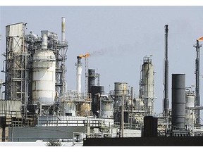 This Galveston Bay, Texas, oil refinery is part of the huge global industry that now has a surplus of crude, leading to a steady drop in prices this year.