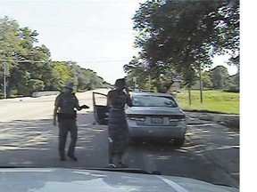 In this July 10 frame from a Texas Department of Public Safety dashcam video, trooper Brian Encinia arrests Sandra Bland, who was found dead in a jail cell on July 13.
