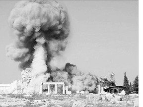 This photo released on a social media site used by Islamic State militants shows smoke from the detonation of an explosive device at the 2,000-year-old temple of Baalshamin in Palmyra.