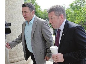 Todd Holt, left, and Sheldon Kennedy arrive at Swift Current court for the Graham James hearing.