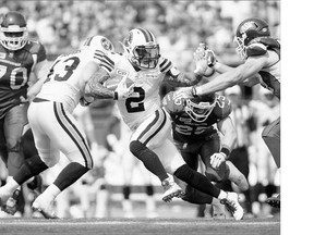 Toronto Argonauts slotback Chad Owens fights through the Rider defence during their game in Regina on Sunday.