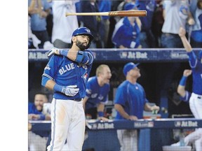 The Toronto Blue Jays' Jose Bautista tosses his bat after hitting a three-run home run in the seventh inning Wednesday.