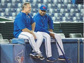 Toronto Blue Jays manager John Gibbons, left, and bench coach DeMarlo Hale share a laugh during a team practice See Simmons, B3 Tuesday at Rogers Centre.