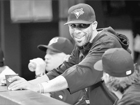 The Toronto Blue Jays' newly acquired starting pitcher David Price, centre, gets acquainted with his new teammates Friday. The prize addition is slated to pitch on Monday. Price was part of a flurry of major deals at the trade deadline for the Jays.
