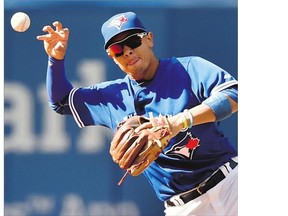 Toronto Blue Jays' shortstop Ryan Goins loses the handle on the ball for an error during Sunday's game against the Boston Red Sox at Rogers Centre. Jays made three errors overall in a 4-3 loss.