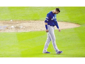 Toronto Blue Jays' Troy Tulowitzki reacts after making the last out in the top of the sixth inning against the Kansas City Royals in Game 6 of the ALCS Friday in Kansas City.