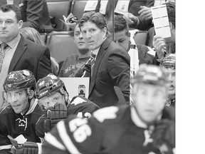 Toronto Maple Leafs head coach Mike Babcock stands behind the bench as his team plays the Montreal Canadiens during second period NHL action in Toronto on Wednesday. The Leafs lost 3-1.