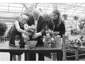 Tory Leader Stephen Harper and wife Laureen do some potting with Conservative candidate Pascale Dery at a recent campaign stop in Drummondville, Que.