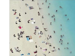 Tourists enjoy the beach on the Greek island of Zakynthos, also known as the 'Island of the Blind' because of a scheme undertaken by some inhabitants who falsely claimed they were blind in order to get compensation.