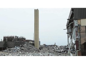 A tower at the former GM transmission plant remains standing after an explosion failed to bring it down in Windsor on Monday.