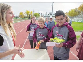 Track star Brianne Theisen-Eaton hosts a free event where she met fans from a track and field club in Strasbourg, Sask., at her former home track, Griffiths Stadium, on Sunday,