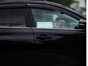 An Uber vehicle is viewed in Manhattan on July 20, 2015 in New York City. (Photo by Spencer Platt/Getty Images)