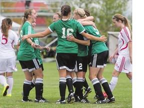 The University of Saskatchewan Huskies celebrate a goal against the University of Winnipeg Wesmen in CIS soccer action on Sunday.