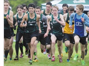 The University of Saskatchewan Huskies Men's cross-country team's Erik Widing, centre, compete in the Sled Dog Track and Field meet Saturday against five other universities in Victoria Park. Widing won the 8K run. The Canada West and CIS Championship is in November,