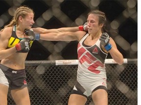 Valerie Letourneau (R) and Maryne Moroz exchange hits during a women’s strawweight bout of UFC Fight Night at SaskTel Centre on August 23, 2015.