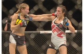 Valerie Letourneau (R) and Maryne Moroz exchange hits during a women’s strawweight bout of UFC Fight Night at SaskTel Centre on August 23, 2015.
