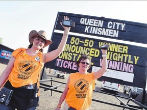 Volunteers Carmen Knaus, left, and Annette Clute sell 50-50 tickets for the Queen City Kinsmen during the 2015 Craven Country Jamboree on friday.