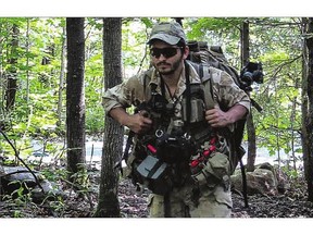 'Wali' was a sniper in the Canadian Armed Forces who did two tours in Afghanistan and then fought with the Kurdish peshmerga against ISIS. In this June 30 file photo, Wali trains in Sainte-Catherine-de-la-Jacques-Cartier near Quebec City.