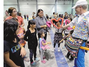 Warren Johnson and his balloons were a big hit with the kids at a carnival put on for fire evacuees at Evraz Place Thursday in Regina.