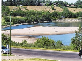 Low water levels on the South Saskatchewan River through Saskatoon expose more sandy beach areas. While it may look pretty, it is has some significant downsides.