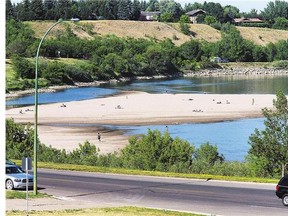 Low water levels on the South Saskatchewan River through Saskatoon expose more sandy beach areas.