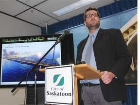 Dan Willems, special projects manager with major projects for the city, can be seen in front of a rendering of the new Traffic Bridge at a recent press conference held by the City of Saskatoon. Now, while the city knows how much the pair of bridges will cost to build and maintain over the next 30 years, it remains unknown to the public.