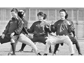 World Championship of Softball team Team Japan goes through stretching exercises before practice Wednesday.