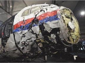 The wrecked cockpit of Malaysia Airlines Flight MH17 is presented to the press during a presentation of the final report on the cause of its crash. Investigators have concluded the aircraft was shot down using a Russian-made missile system.
