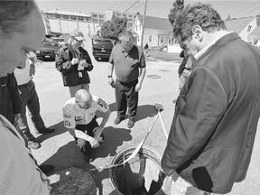 New York Gov. Andrew Cuomo, right, with Steven Racette, centre, superintendent of Clinton Correctional Facility, inspect a manhole from which two inmates fled in Dannemora, N.Y. Racette is among 12 more staff put on administrative leave during the investigation into David Sweat and Richard Matt's escape from the maximum-security prison.