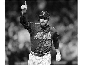New York Mets' Daniel Murphy celebrates one of his seven post-season homers.