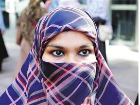 Zunera Ishaq talks to reporters outside the Federal Court of Appeal Tuesday after her case was heard on whether she can wear a niqab while taking her citizenship oath,