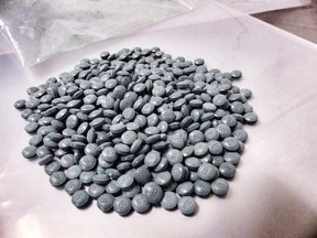Fentanyl pills are shown in an Alberta police handout photo.