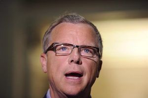 Saskatchewan Premier Brad Wall speaks at the Saskatchewan Legislative Building in Regina, Sask., Friday, July 24, 2015. Wall wants the federal government to suspend its plan to bring in 25,000 Syrian refugees by the end of the year. THE CANADIAN PRESS/Mark Taylor