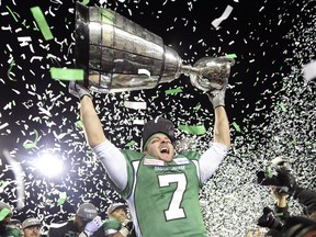 Weston Dressler the Grey Cup at the end of the 101st Grey Cup game held at Mosaic Stadium in Regina, Sask. on Sunday Nov. 24, 2013.