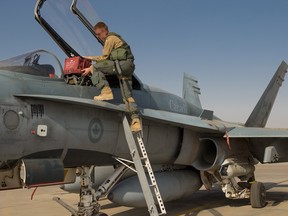 A Canadian CF-18 Hornet being prepared for a mission against ISIL.