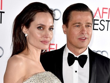 Actor/director Angelina Jolie Pitt (L) and husband actor Brad Pitt arrive at the AFI FEST 2015 presented by Audi opening night gala premiere of Universal Pictures' "By The Sea" at the Chinese Theatre on November 5, 2015 in Los Angeles, California.