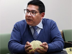 Neurosurgeon Ivar Mendez explains the 3D model brain developed to help plan surgery.