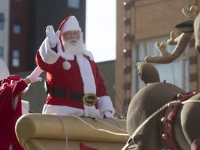 Santa Claus waves as the Santa Claus parade makes its way down Second Avenue North in Saskatoon, November 15, 2015.