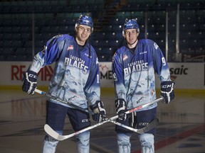 WHL's Saskatoon Blades players Ryan Graham and Cameron Hebig display their Star Wars theme jerseys they will be wearing during this weekends home game and then auctioning them off after the game, November 26, 2015.