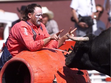 Bullfighter Ryan Byrne teases  a fighting bull at the Calgary Stampede Rodeo in 1999.