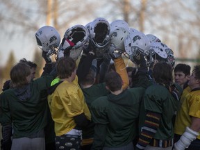 The Carrot River Wildcats boys six-man football team practice on the school grounds early in the morning on on Oct. 22, 2015.