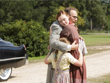 Dalton Trumbo (played by Bryan Cranston) comes home to the embrace of his children, including daughter Niki Trumbo (played by Elle Fanning) in Jay Roach's "Trumbo," an Entertainment One release.